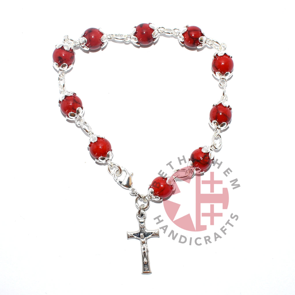 Olive wood rosary hand made in Bethlehem Holy Land, side angle of the olive wood sculpture