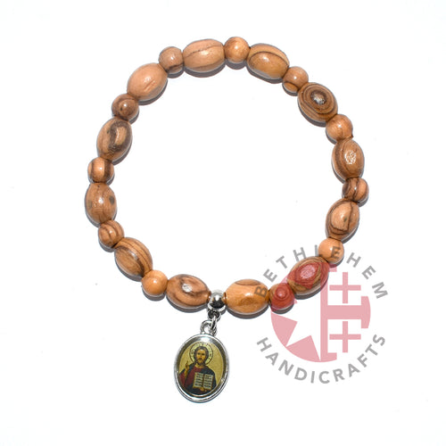 Olive wood rosary hand made in Bethlehem Holy Land, side angle of the olive wood sculpture