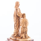 Jesus Christ statue hand carved from Bethlehem olive wood, 9.4 inch three quarter view of the religious piece