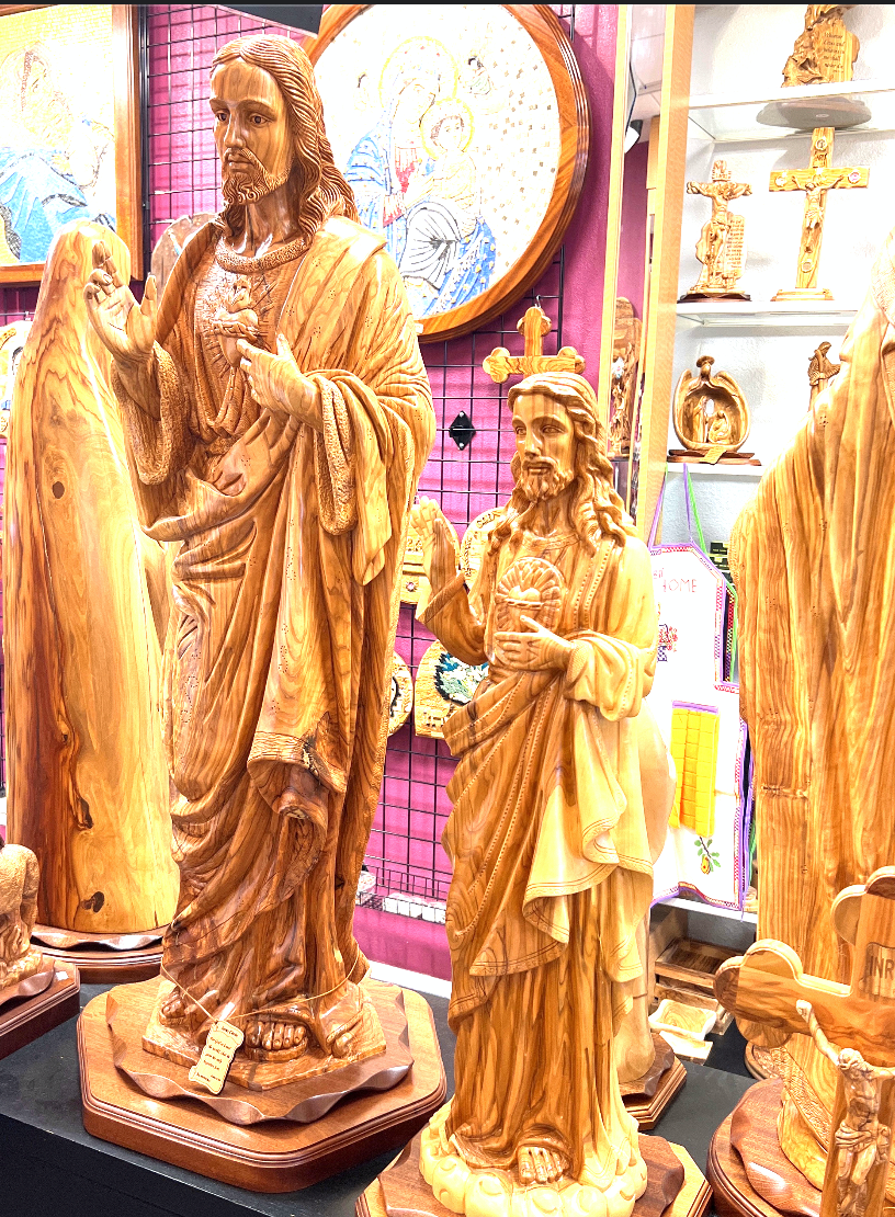 Jesus Christ statue hand carved from Bethlehem olive wood, close detail of the hand carved work