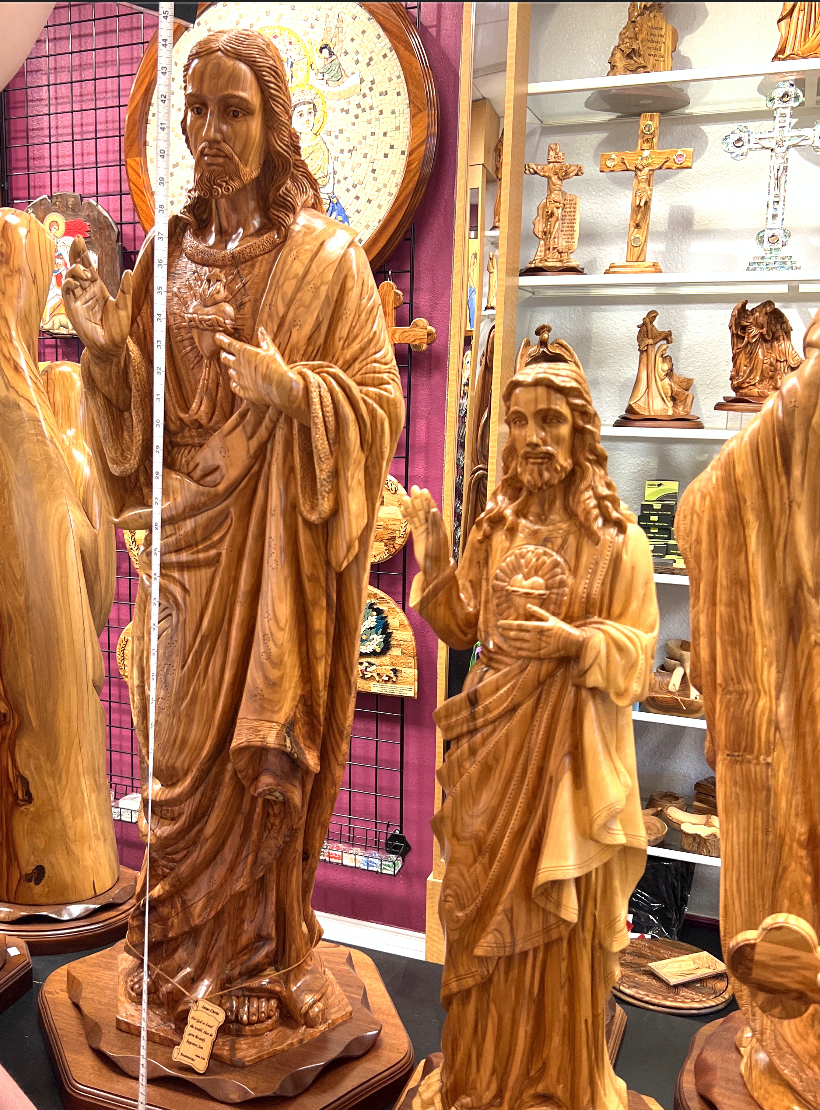 Jesus Christ statue hand carved from Bethlehem olive wood, three quarter view of the religious piece