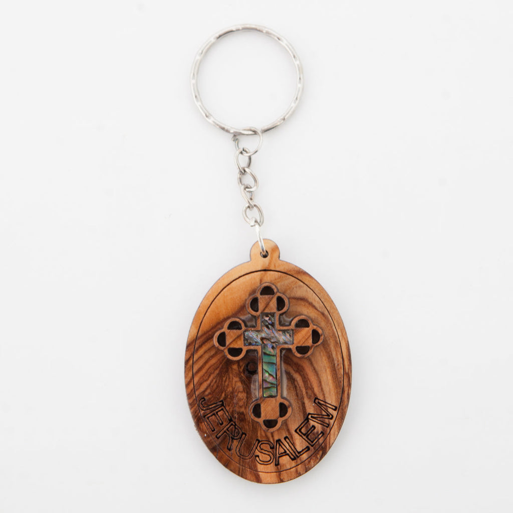 Olive wood keychain religious gift from Bethlehem, side angle of the olive wood sculpture