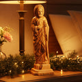 A hand-carved olive wood statue of St. Jude Thaddaeus, with a flame around his head, holding a Christ image.