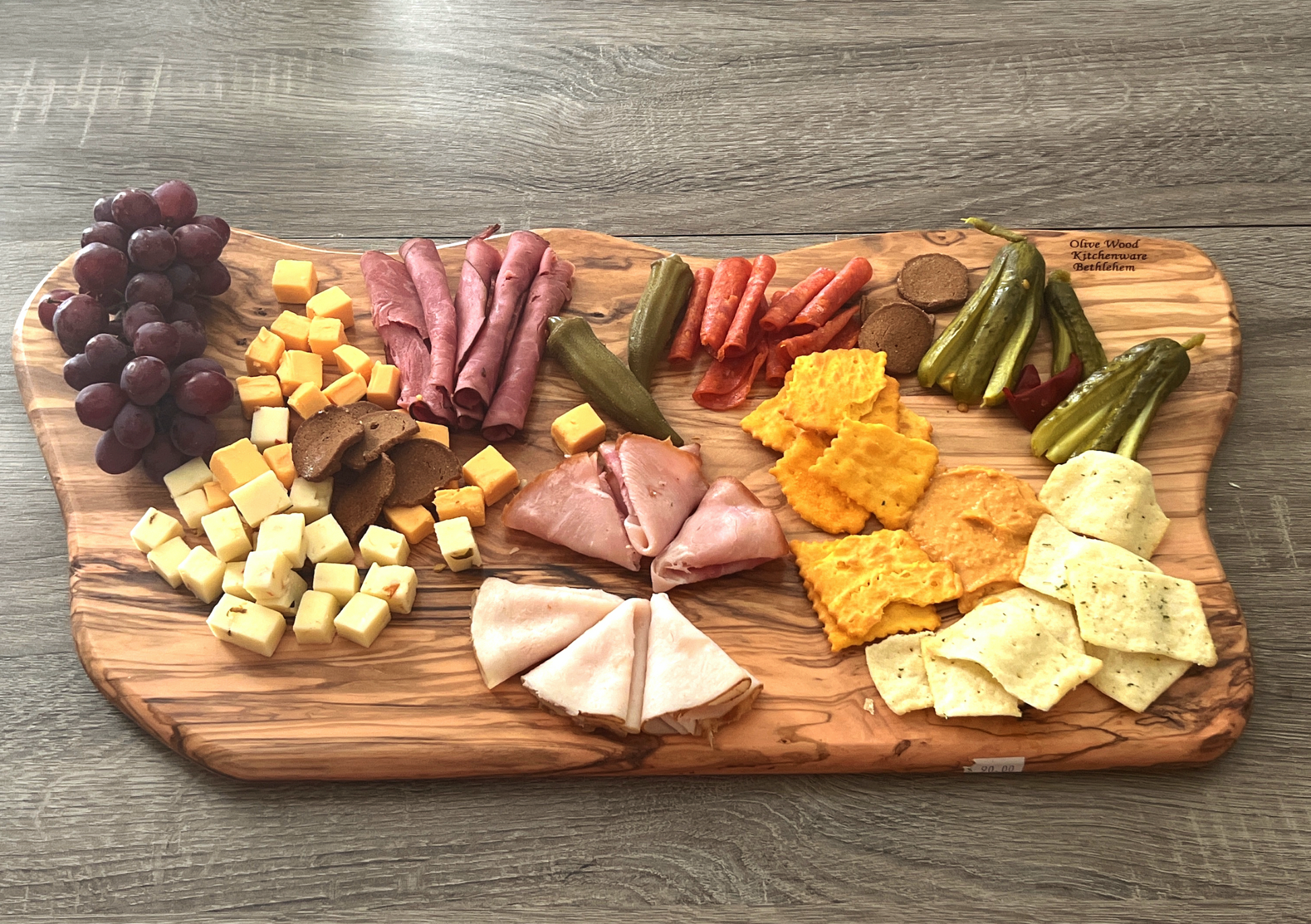 https://bethlehemhandicrafts.com/cdn/shop/products/Wood-Cutting-Board-Charcuterie-Olive9.png?v=1684632176&width=1946