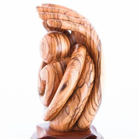 Agape Carving of Baby being Protected by Hand of God, Abstract Mercy of God in Olive Wood, Beautiful Realistic Hands