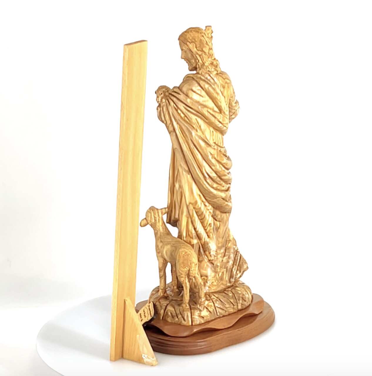 Good Shepherd statue hand carved from Bethlehem olive wood, 18.5 inch lifestyle photo on display