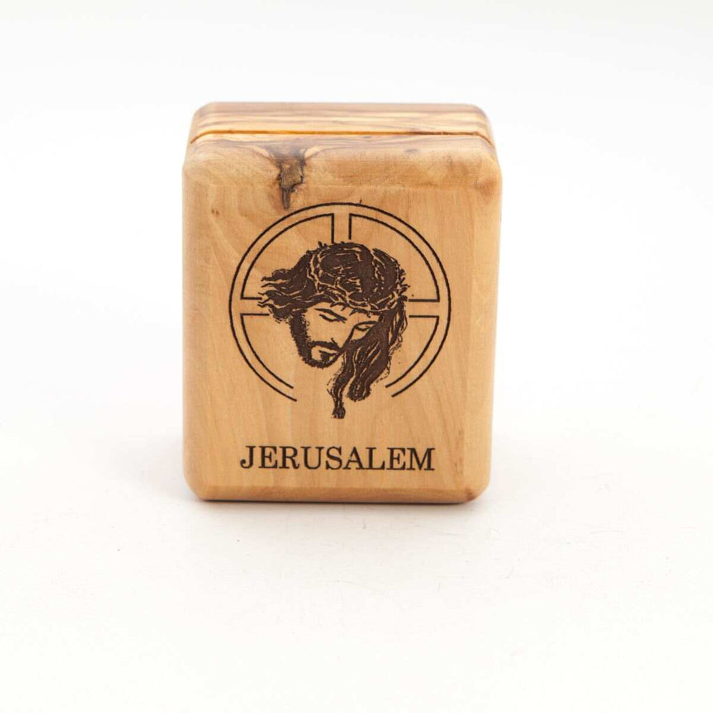 A rectangular olive wood box with a Jesus Christ engraving and the word 'Jerusalem' below it.