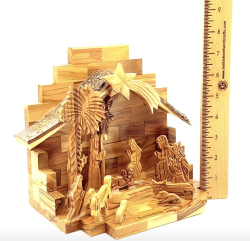 Olive wood nativity scene hand carved in Bethlehem, 9.1 inch side angle of the olive wood sculpture