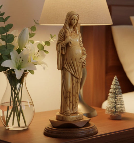 An 11.8 inch olive wood carving statue of the Virgin Mary, positioned on a flat surface with a tape measure for scale.
