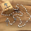 Rosary with Pearl White Oval Beads, Metal Chain and 2" Crucifix
