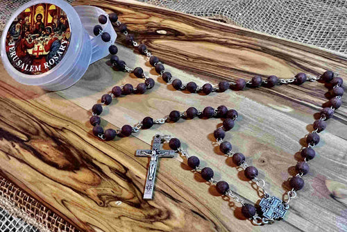 Olive wood rosary hand made in Bethlehem Holy Land, side angle of the olive wood sculpture
