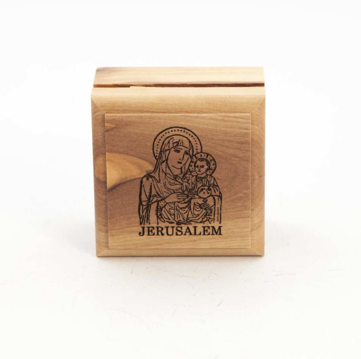 A hand-carved wooden rosary or ring box with an engraved image of the Virgin Mary and Jesus on the lid, with the word 'Jerusalem' below. The box is light brown in color.