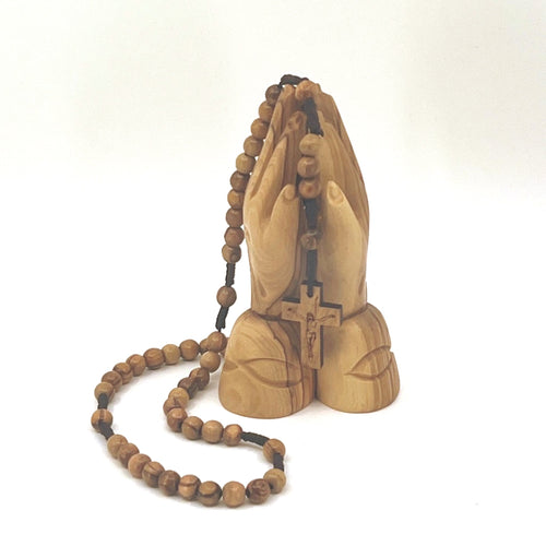 Olive wood crucifix hand carved in Bethlehem, side angle of the olive wood sculpture