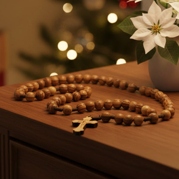 A traditional Catholic rosary with large wooden beads, featuring a cross at the center, hand made from Holy Land olive wood.