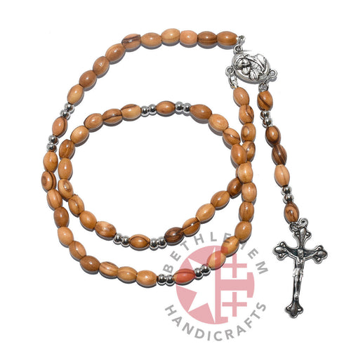 Olive wood rosary hand made in Bethlehem Holy Land, side angle of the olive wood sculpture