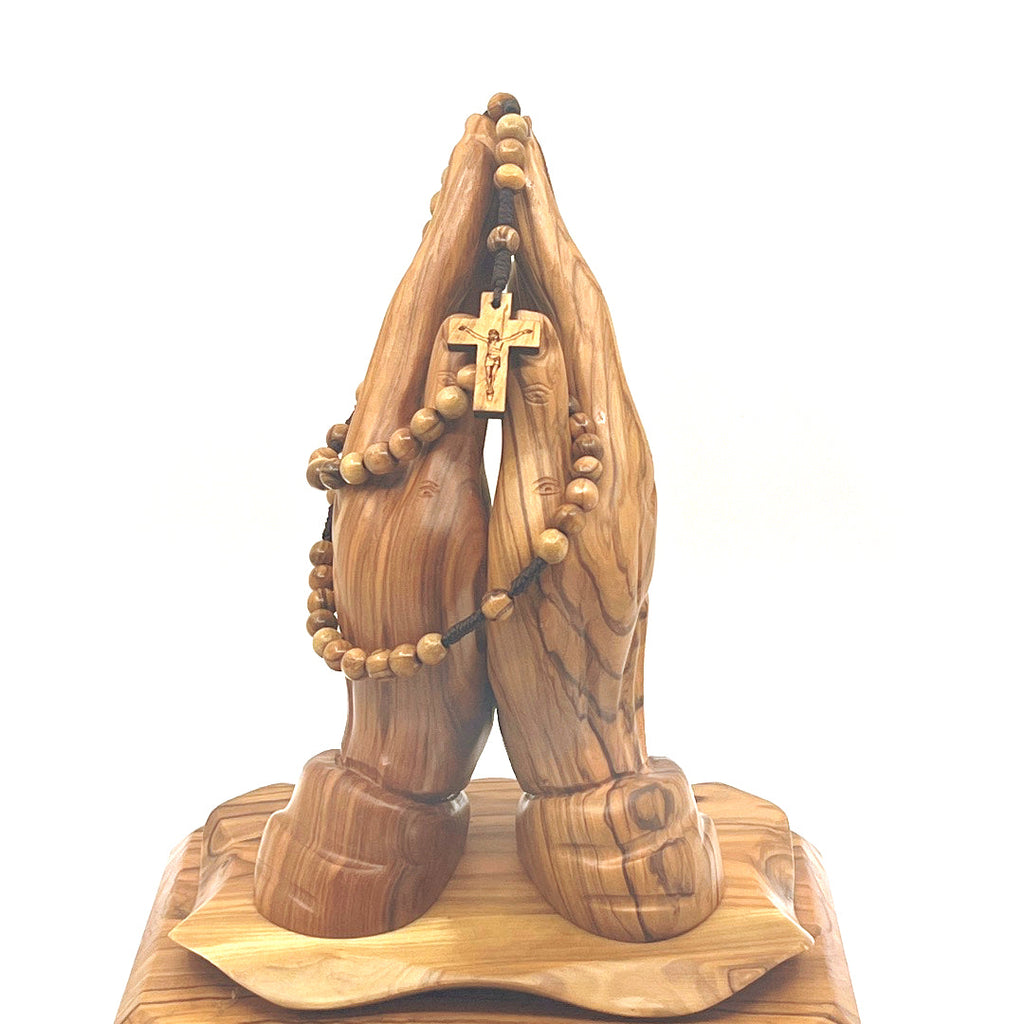 Olive wood crucifix hand carved in Bethlehem, close detail of the hand carved work